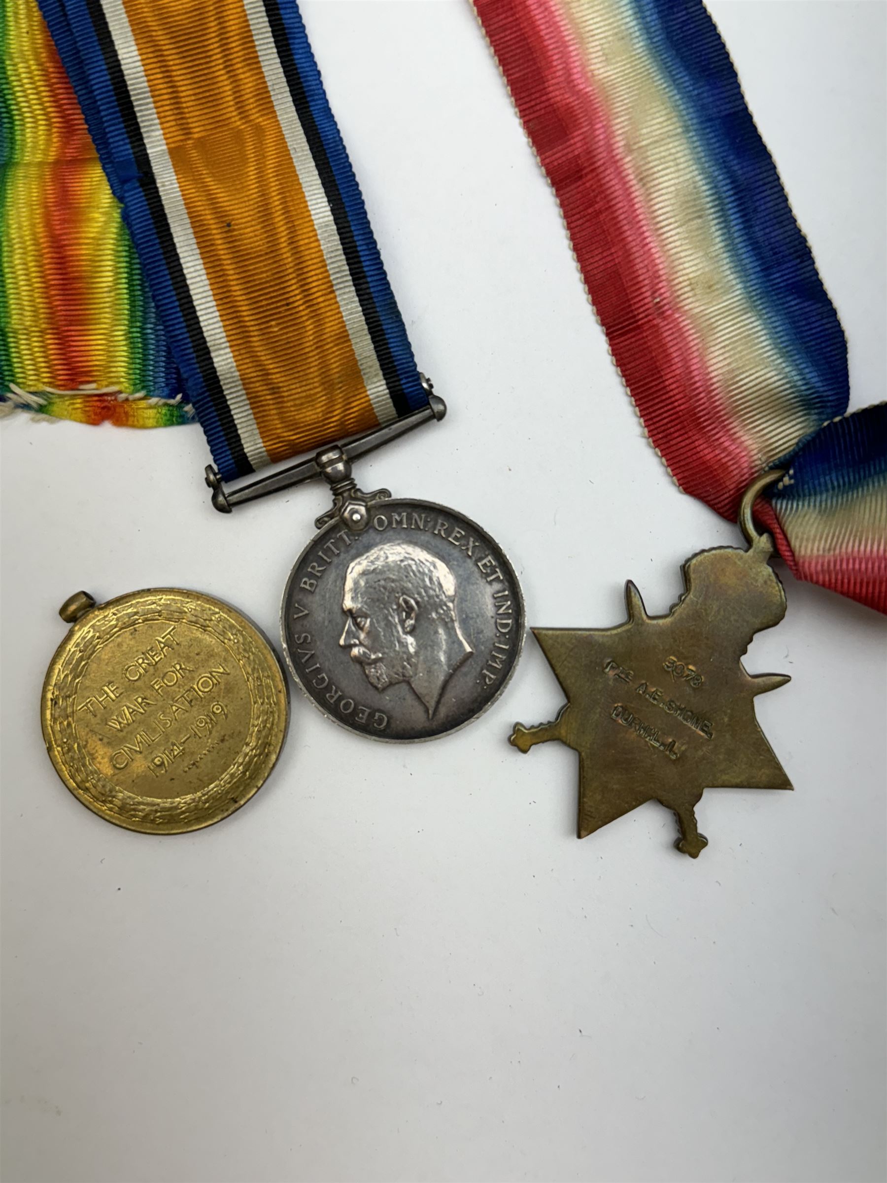Three WWI medals, comprising 1914-15 Star, British War Medal and Victory Medal awarded to 3078 Private A.E Shone Durham Light Infantry