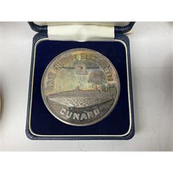 Silver 1969 Cunard RMS Queen Elizabeth maiden voyage commemorative medallion, in original Slade, Hampton & Son case with certificate, two Stratton R.M.S Queen Elizabeth mirror compacts, Stratton R.M.S Queen Mary compact, mid 20th century P&O Canberra Round World Voyage miniature globe, S.S Oriana ash tray modelled as a barrel, Norah Wellings sailor doll, and other maritime and shipping memorabilia 