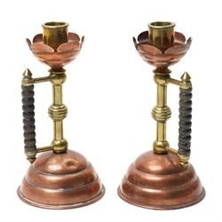Pair of Arts and Crafts brass and copper candlesticks after a design by Dr Christopher Dre...