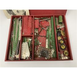 Meccano Set No.5 wooden box containing quantity of predominantly red and green sections, parts, brackets, wheels etc and instruction booklet
