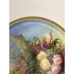 19th century porcelain stand, of circular form, in the Derby style, hand painted with a ruinous column and roses against a landscape background, within a gilt border, D7cm