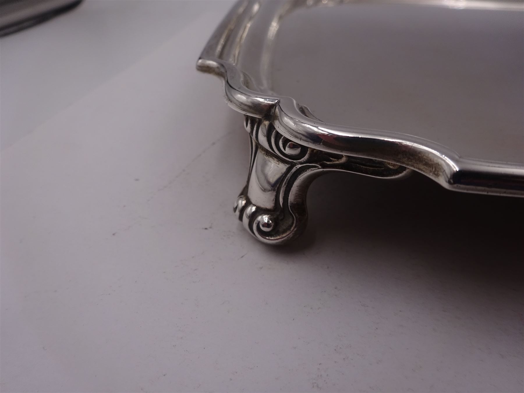 1930s silver tray, of square form with shaped canted corners and stepped rim, upon four bracket feet, hallmarked Frank Cobb & Co Ltd, Sheffield 1936, W31cm