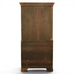 George III mahogany bureau bookcase, with projecting cornice top with dentil detail, astragal glazed cabinet enclosing fixed shelves, the lower section with fall front writing surface, fitted interior above four graduated drawers, raised on bracket feet