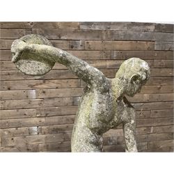 Life-size weathered cast stone Greek Discus Athlete, seated on rectangular slab raised on associated architectural plinth