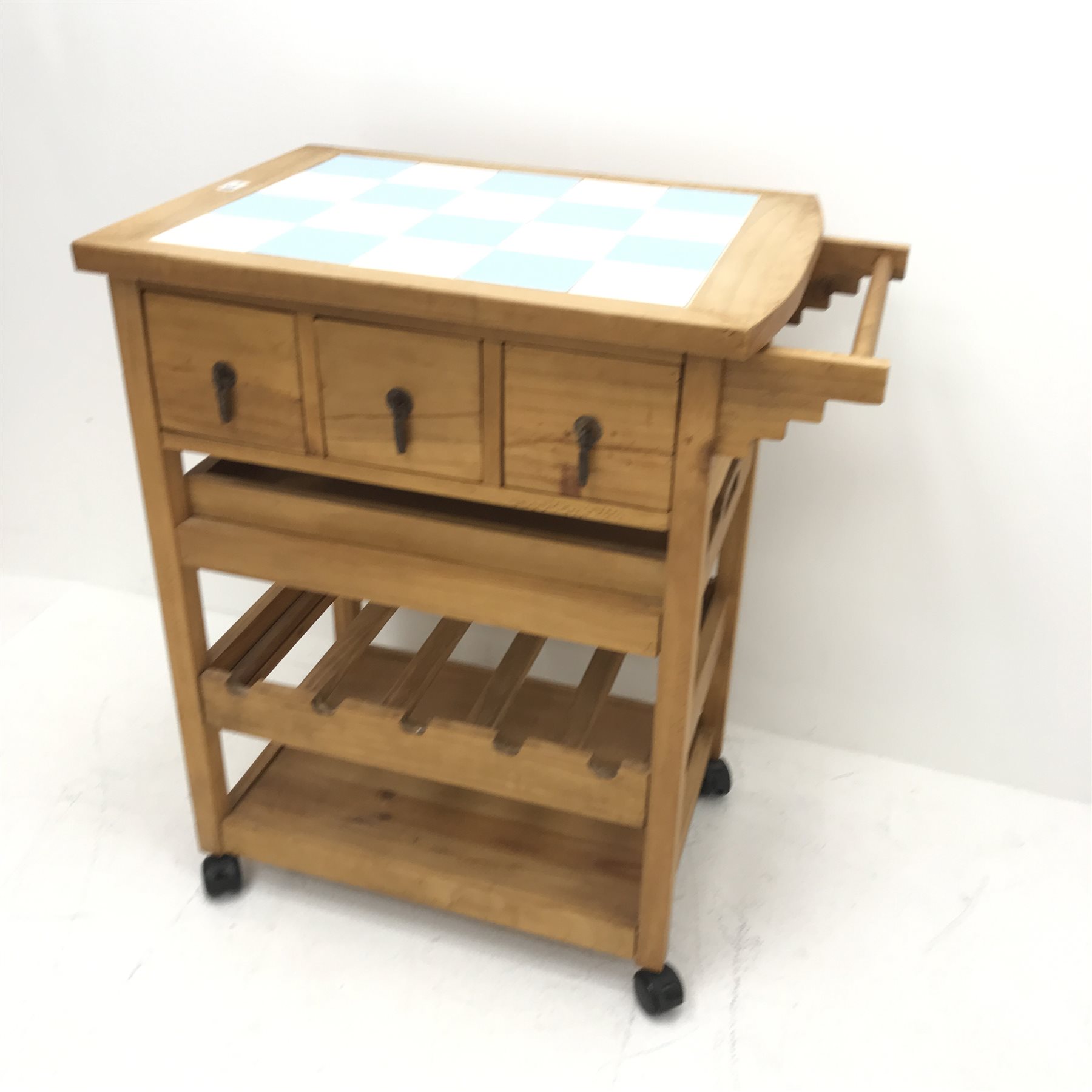 Tiled top kitchen trolley, three short drawers, single drawer, five