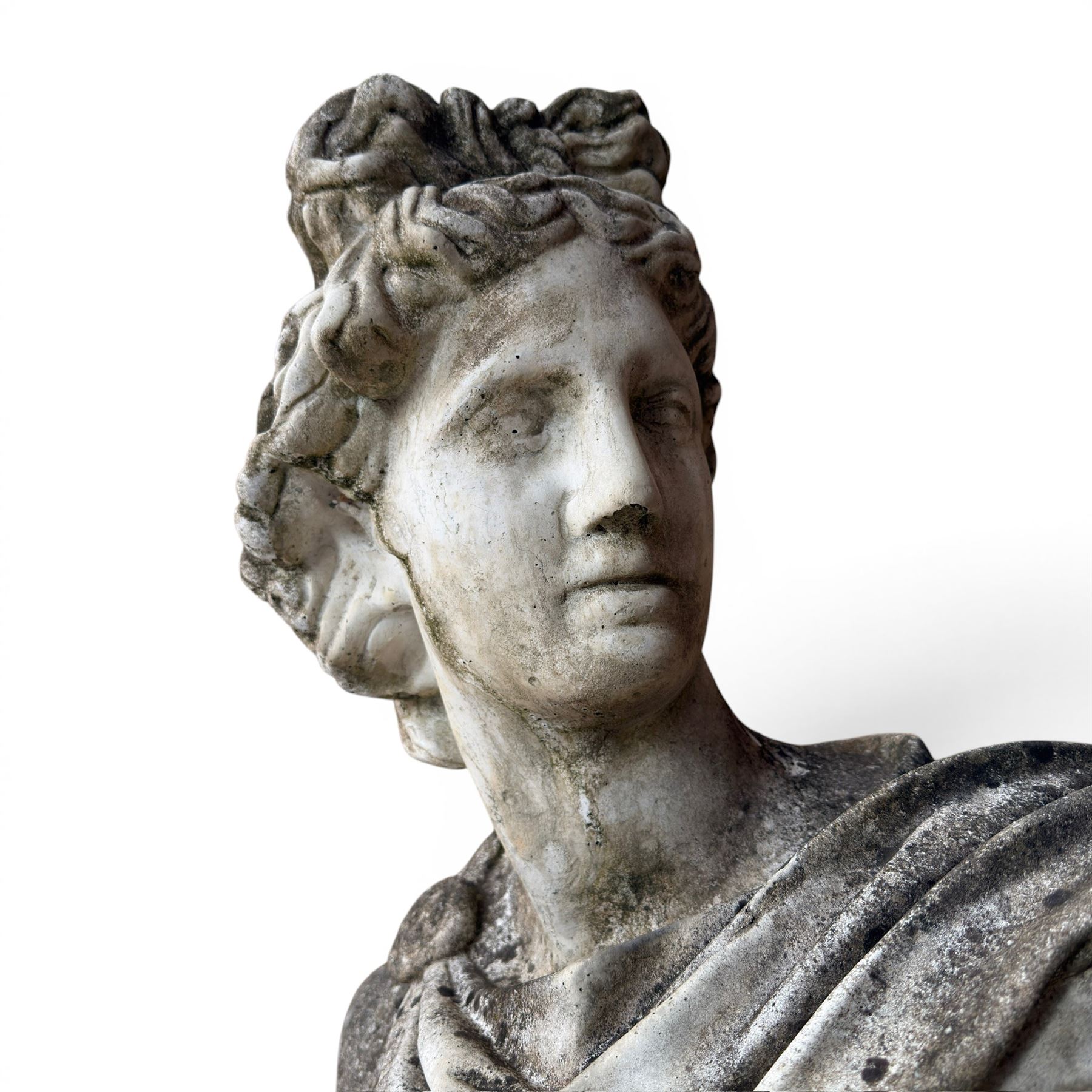 Roman Neoclassical style cast stone bust, weathered finish, raised on textured stone plinth of tapering form