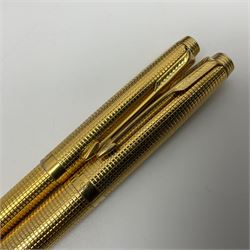 Conway Stewart fountain pen with a 14 ct gold nib, together with a Parker fountain pen and ballpoint pen gilt metal set, together with two other pens 
