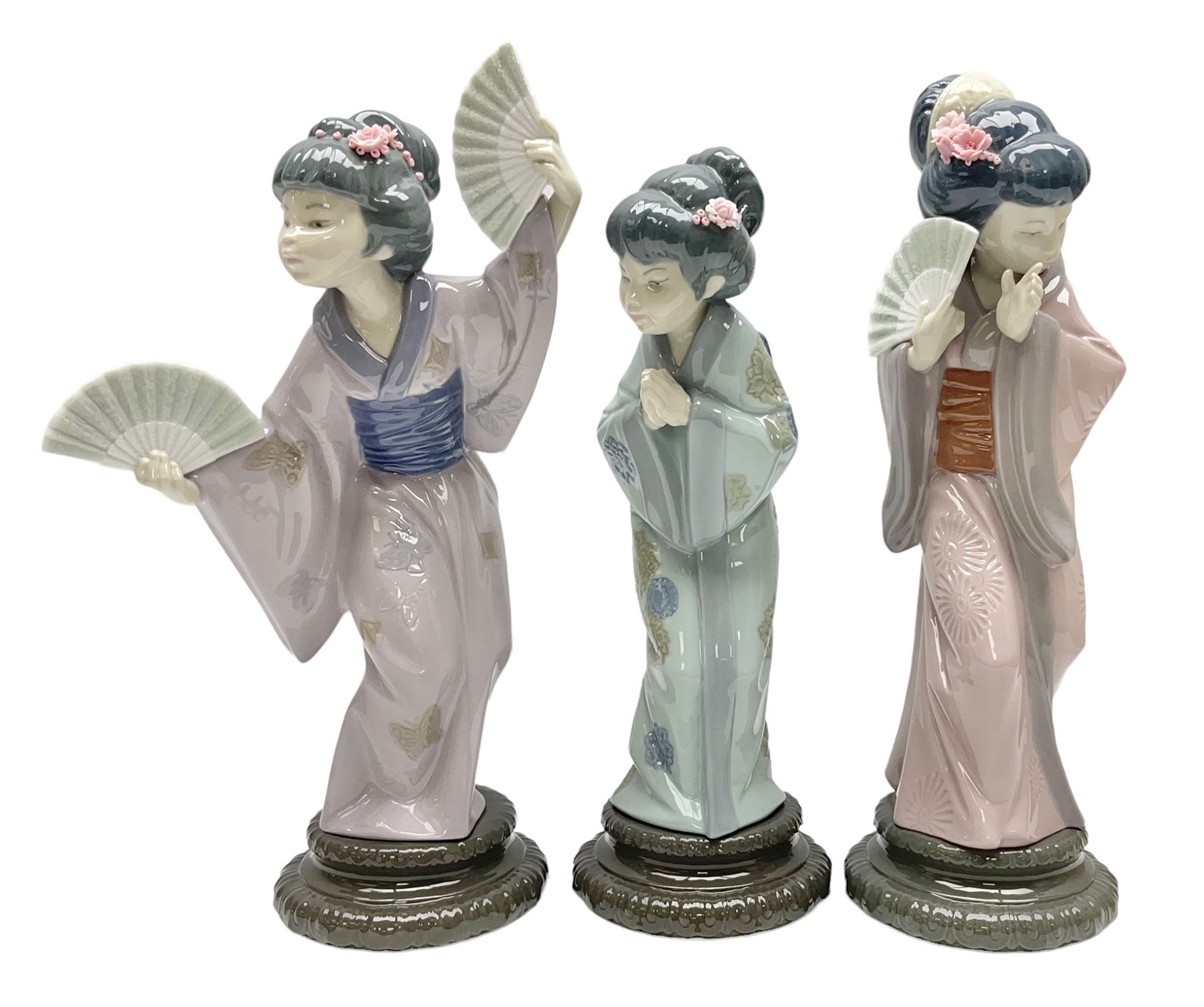 Three Lladro Japanese figures, comprising Sayonara no. 4989, Chrysanthemum no. 4990 and Madame Butterfly no. 4991, largest H30cm
