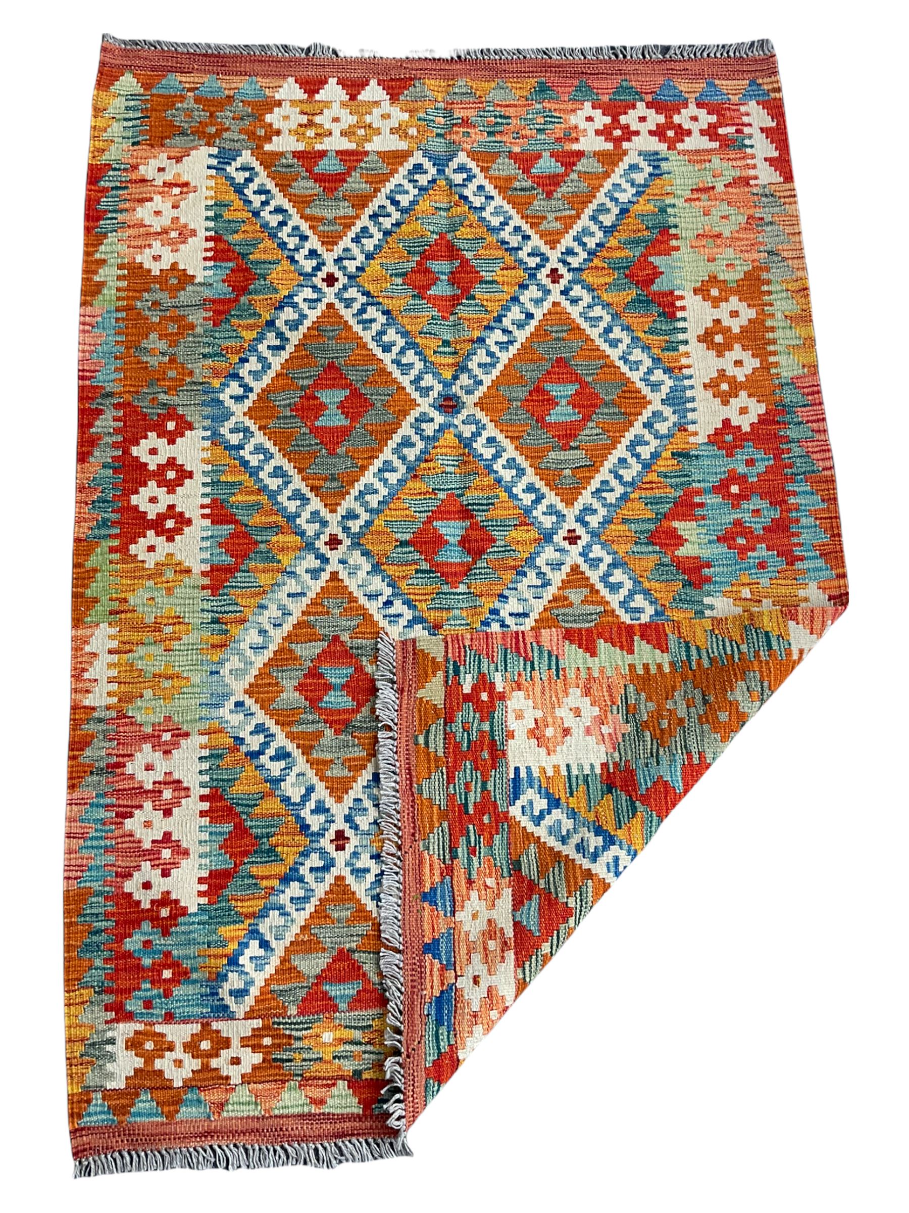 Chobi Kilim rug, orange ground with lozenge and geometric pattern