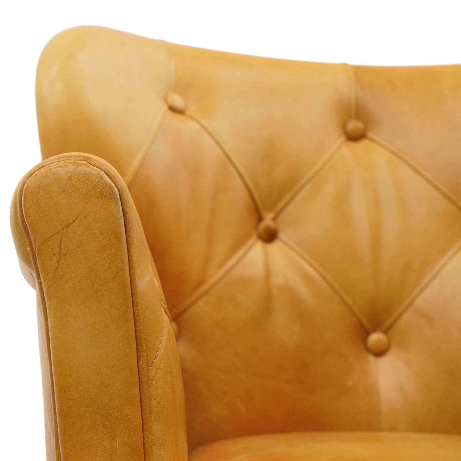 John Lewis - Pair of ochre leather tub chairs, downswept arms, button back and arms, raised on dark supports 