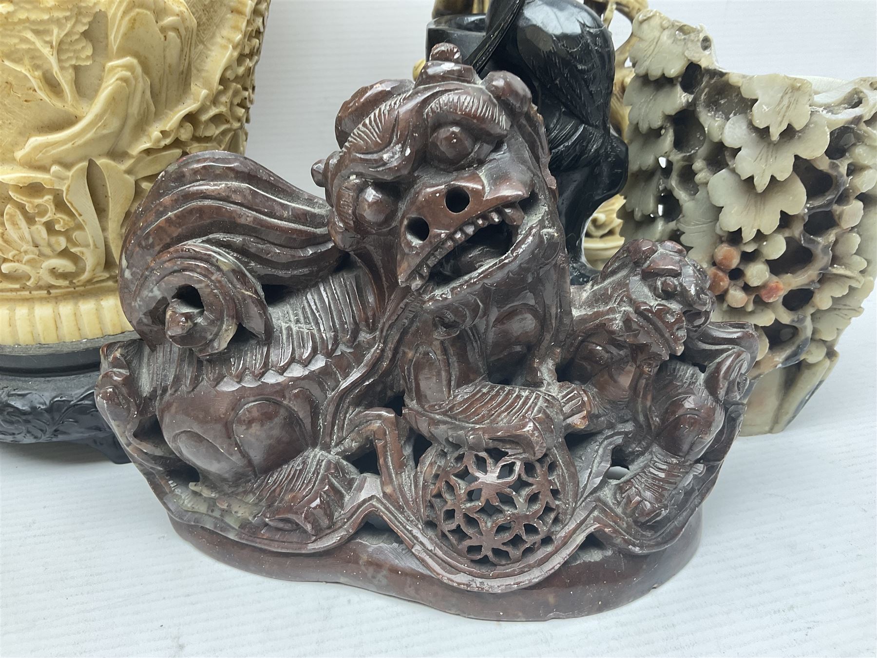 Collection of hardstone and soapstone, including hardstone seal carved temple dogs finial, inscription on base, together with inkwells, vases etc  
