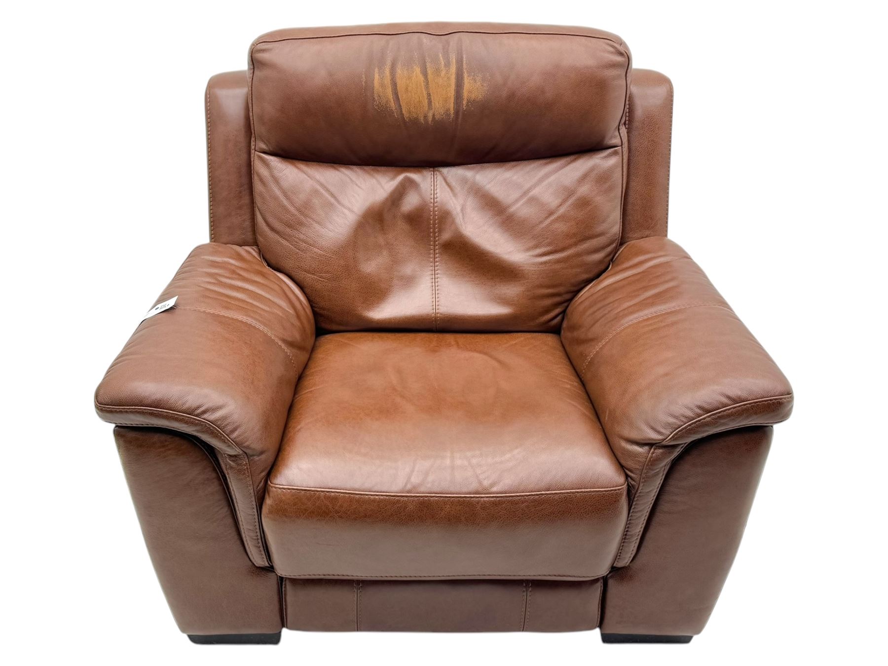 DFS - 'Liaison' reclining armchair upholstered in brown leather, upholstered in tan leather with stitched panel backrest and generously cushioned seat and arms, operated by wired remote, raised on block feet