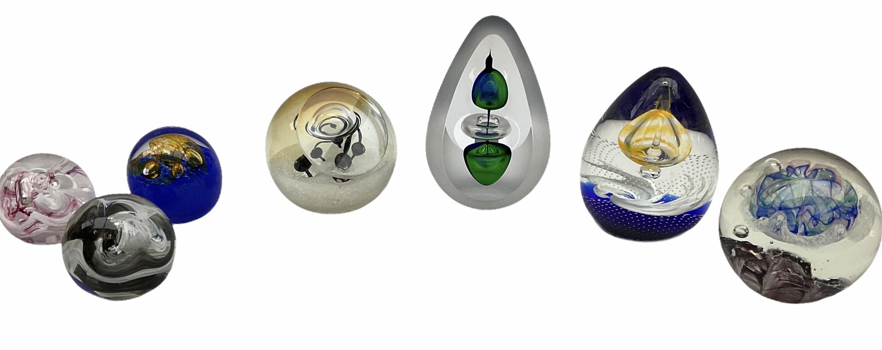 Svaja glass paperweight, together six other paperweights, including four Caithness examples. 