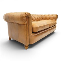 Alexander James - Chesterfield tan three seat sofa, button backed with scrolled arms, brass studded trim raised on light wood turned feet