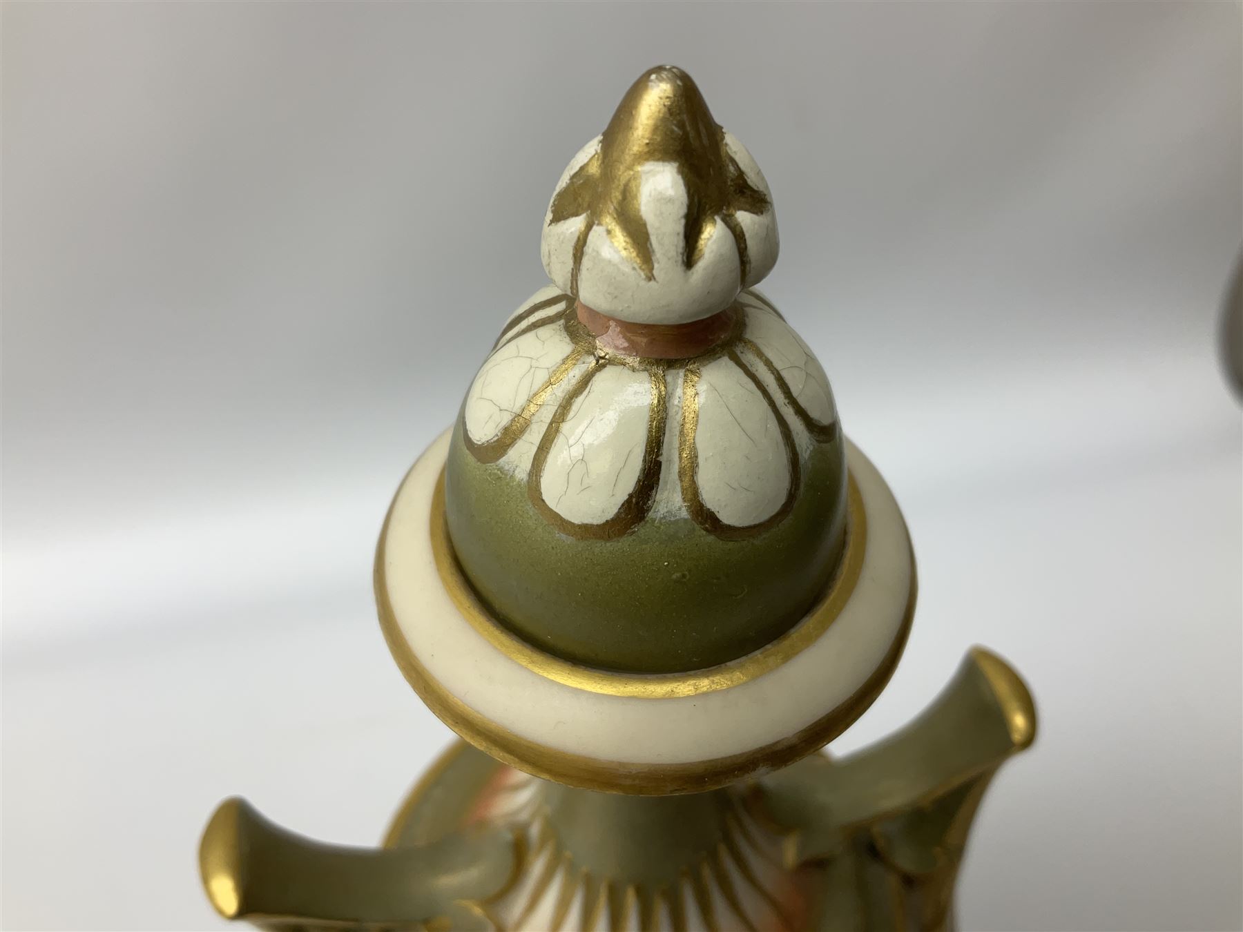 Early 20th century Royal Worcester vase decorated by Harry Davis, of ovoid form with twin acanthus mounted handles and waisted high neck supporting a domed cover, upon a circular foot, the body hand painted with sheep in a highland landscape, signed H Davis, with puce printed marks beneath including shape number 2425, and date code for 1907, H27.5cm
