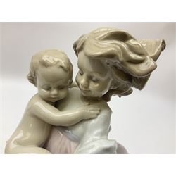Three Lladro figures, comprising Playing Mom no 6681, Little Riders no 7623 and Pick of the Litter no 7621, all with original boxes, largest example H24cm