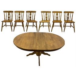 Light wood circular extending kitchen table, and six farmhouse chairs