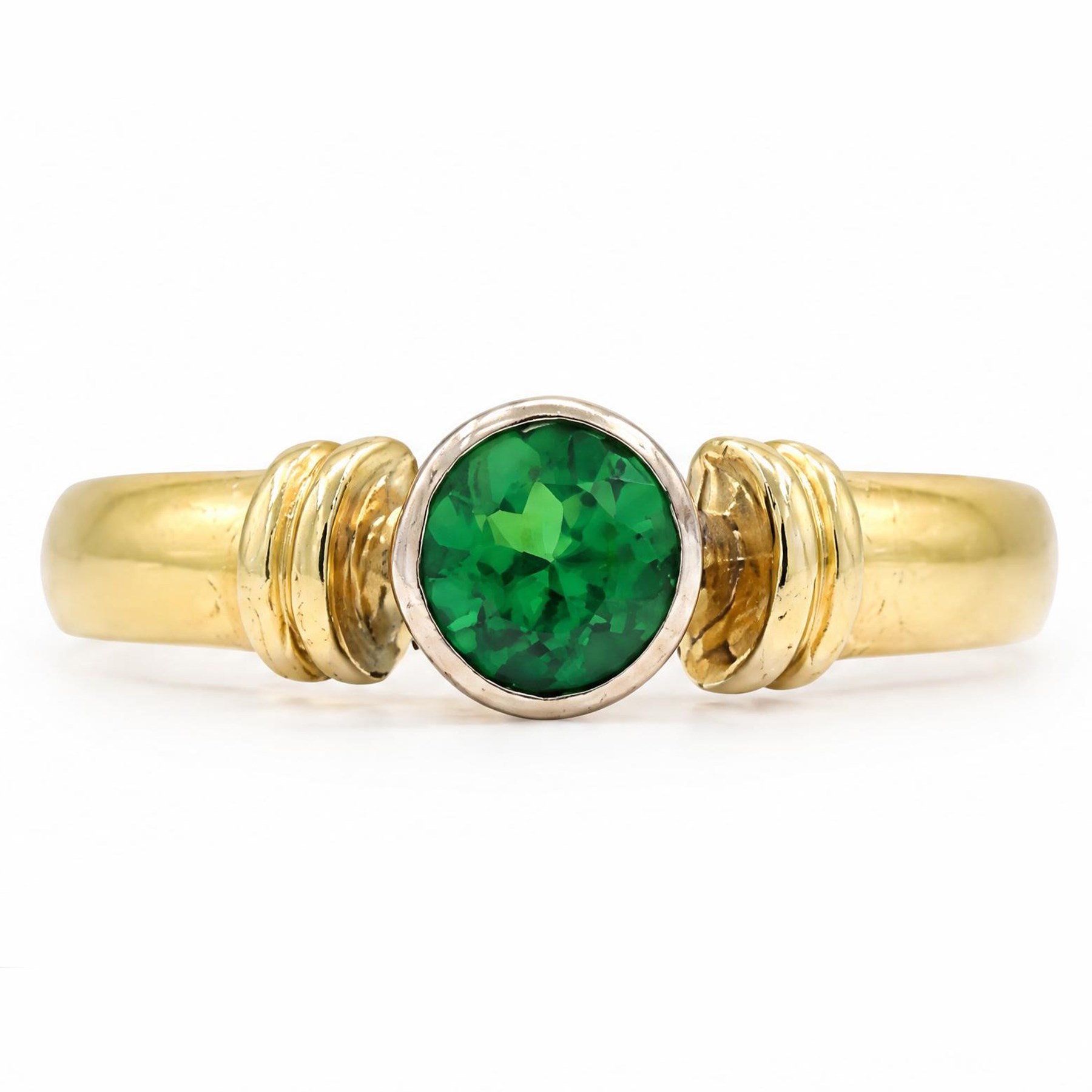 18ct gold tsavorite garnet ring, bezel set with a single round cut garnet, Birmingham 1992