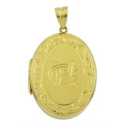 18ct gold oval locket, with monogrammed initials and engraved leaf and scroll decoration, hallmarked