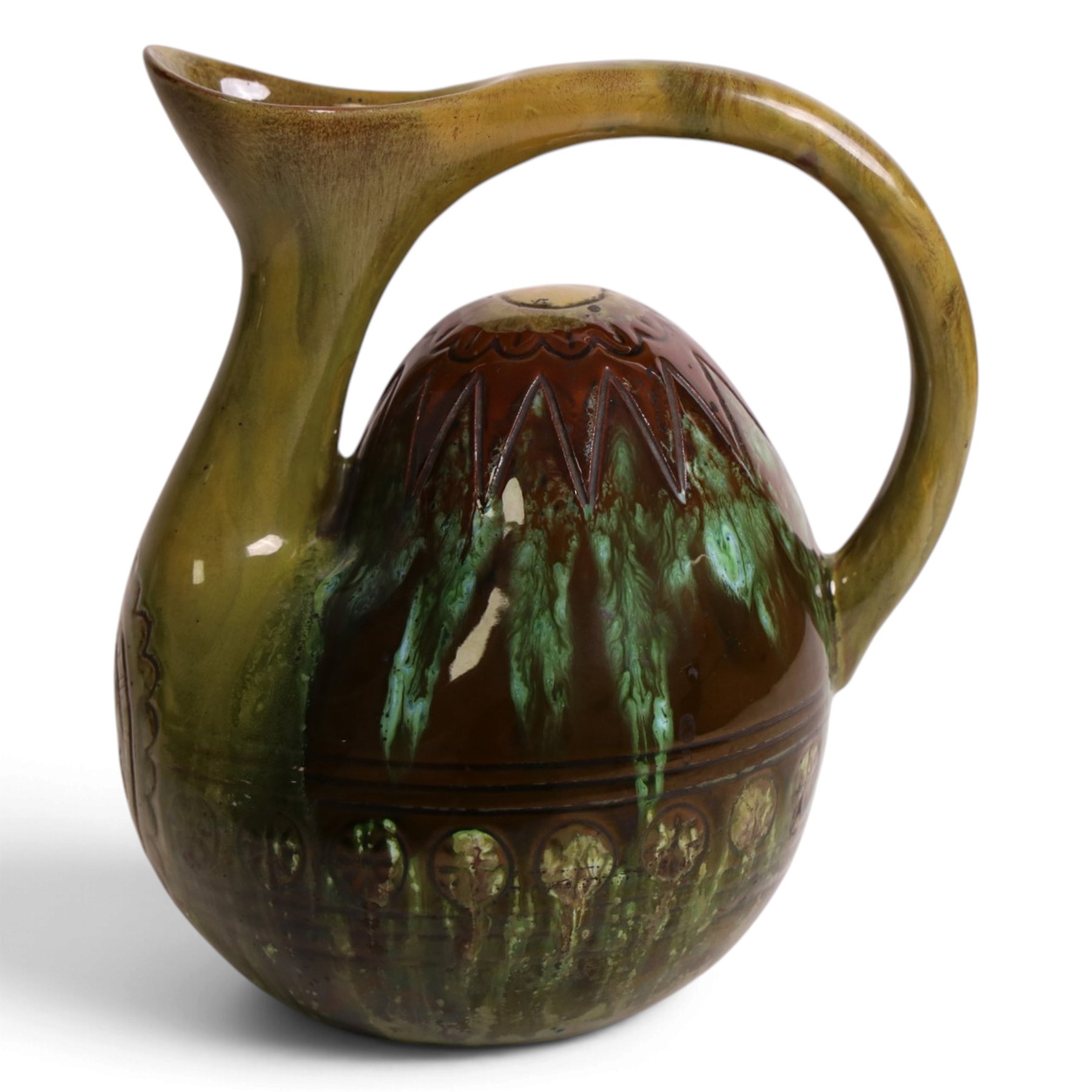Dr Christopher Dresser - Linthorpe pottery hump back water jug with incised and green glazed decoration and loop handle, facsimile signature and numbered 347 H17cm