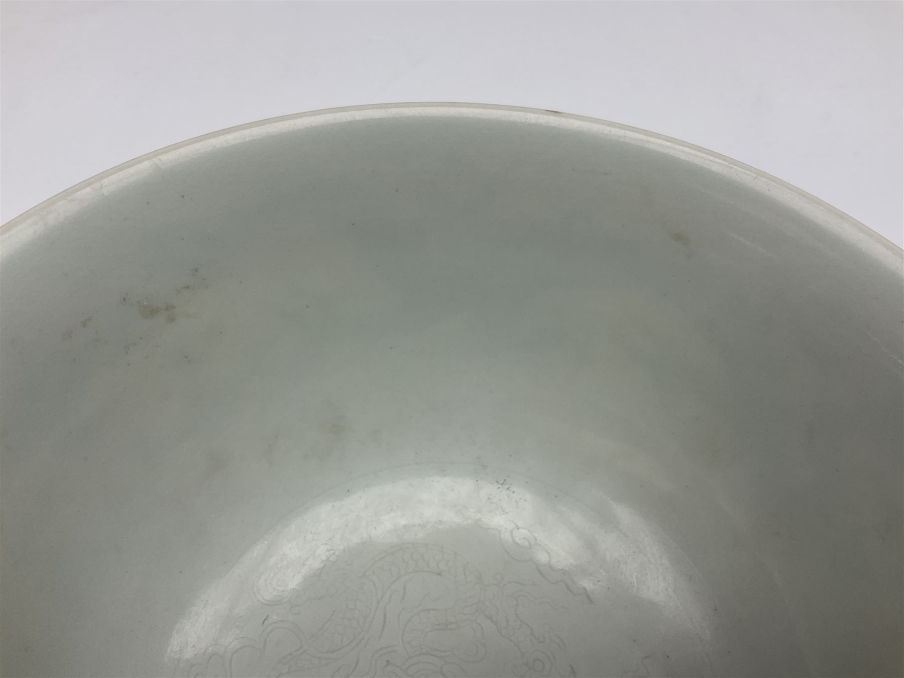 Pair of Chinese famille jaune bowls, decorated in green enamel with a dragon chasing a flaming pearl amongst clouds, upon a yellow ground, the interior decorated to centre with dragon, with six character mark beneath, D17.5cm