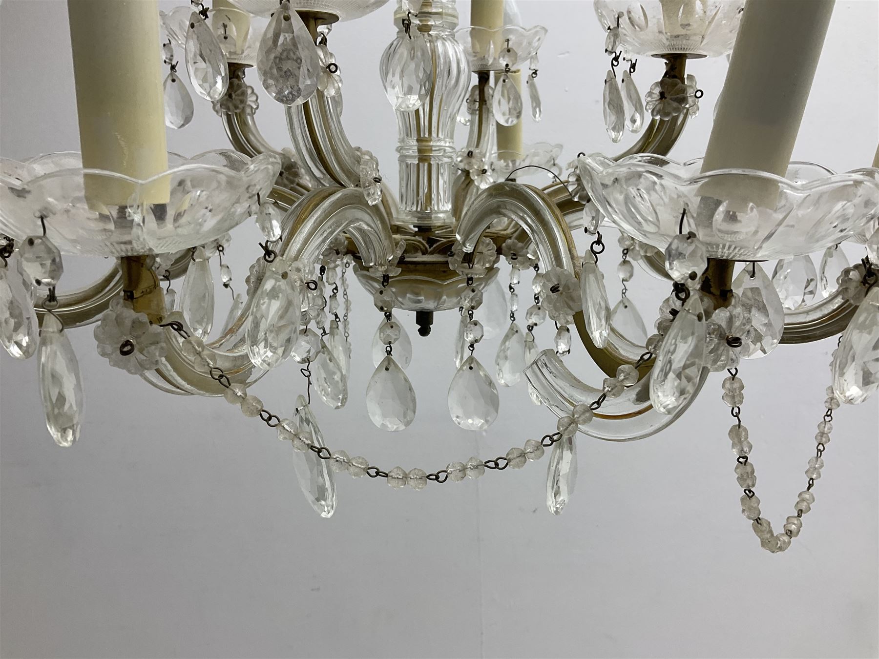 Victorian style glass eight branch chandelier, with drip trays, brass tone support, and drops
