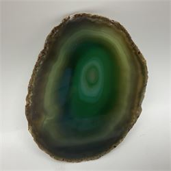 Pair of green agate slices, polished with rough edges raised upon silvered metal stands, H19cm