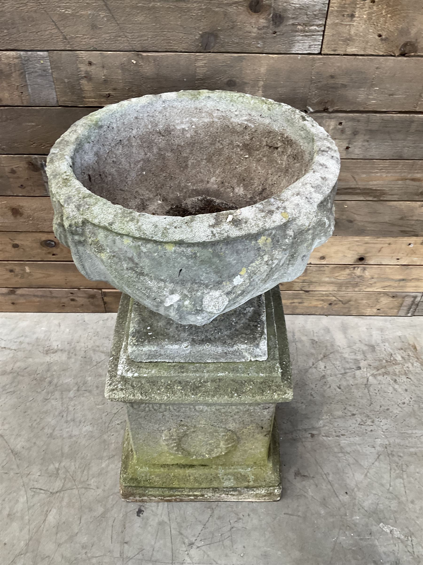 Cast stone centerpiece urn on plinth