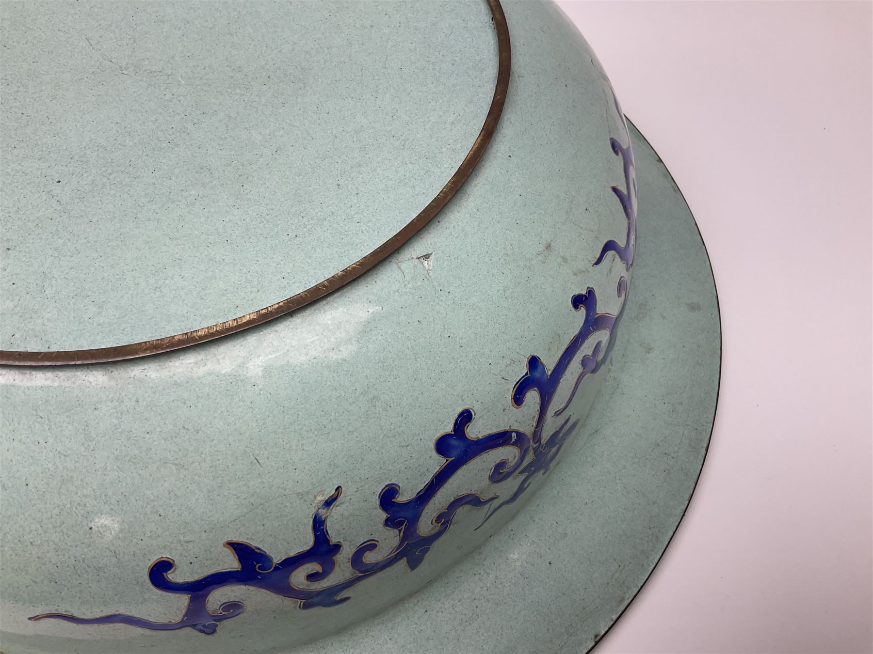 18th/19th century Chinese Canton enamel basin, the circular basin with flat everted rim, decorated with scrolling foliate and fruit decoration on a blue ground, D43cm