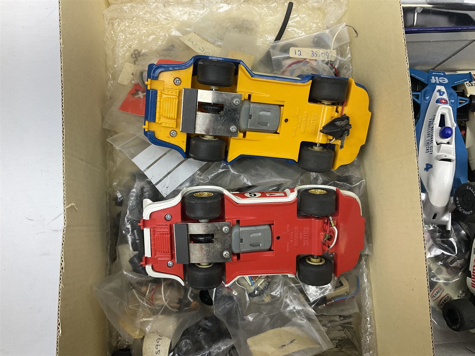 Scalextric - John Player Special racing car; boxed; two C125 Porsche cars; C135 Tyrrell 008 racing car; Honda racing car; all unboxed; quantity of unused and used spare parts including motors, wheels and other accessories etc