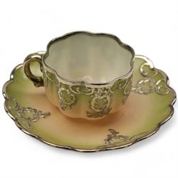 Three Pirkenhammer cups and saucers, two decorated with gilt birds in foliage on an ivory ground, the other with butterflies and foliate sprigs together with three  continental cups and saucers decorated with silver overlay 