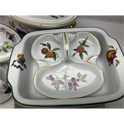 Royal Worcester Evesham pattern, including covered pot de cremes, twin handle tureen, serving dishes, flan dishes, side plates etc  