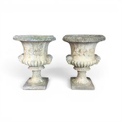 Pair of large cast stone garden urns, circular form with egg and dart border, tapering gadrooned bowl with cast handles and detail