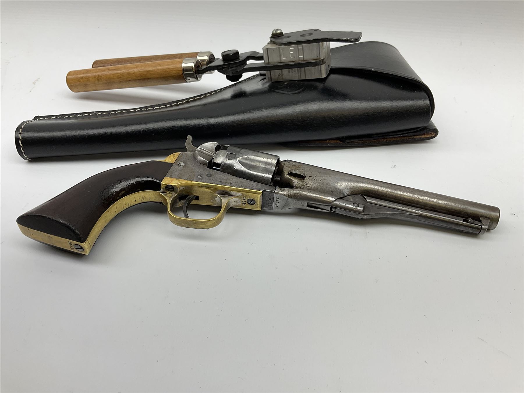 Colt .36 calibre percussion five-shot police pocket revolver, all parts with matching serial no.18334, 14cm barrel marked 'Address Col Saml Colt New York US America' with under barrel swivel rammer, brass trigger guard and backstrap with two-piece wooden grips L28.5cm; with modern bullet maker and leather holster.