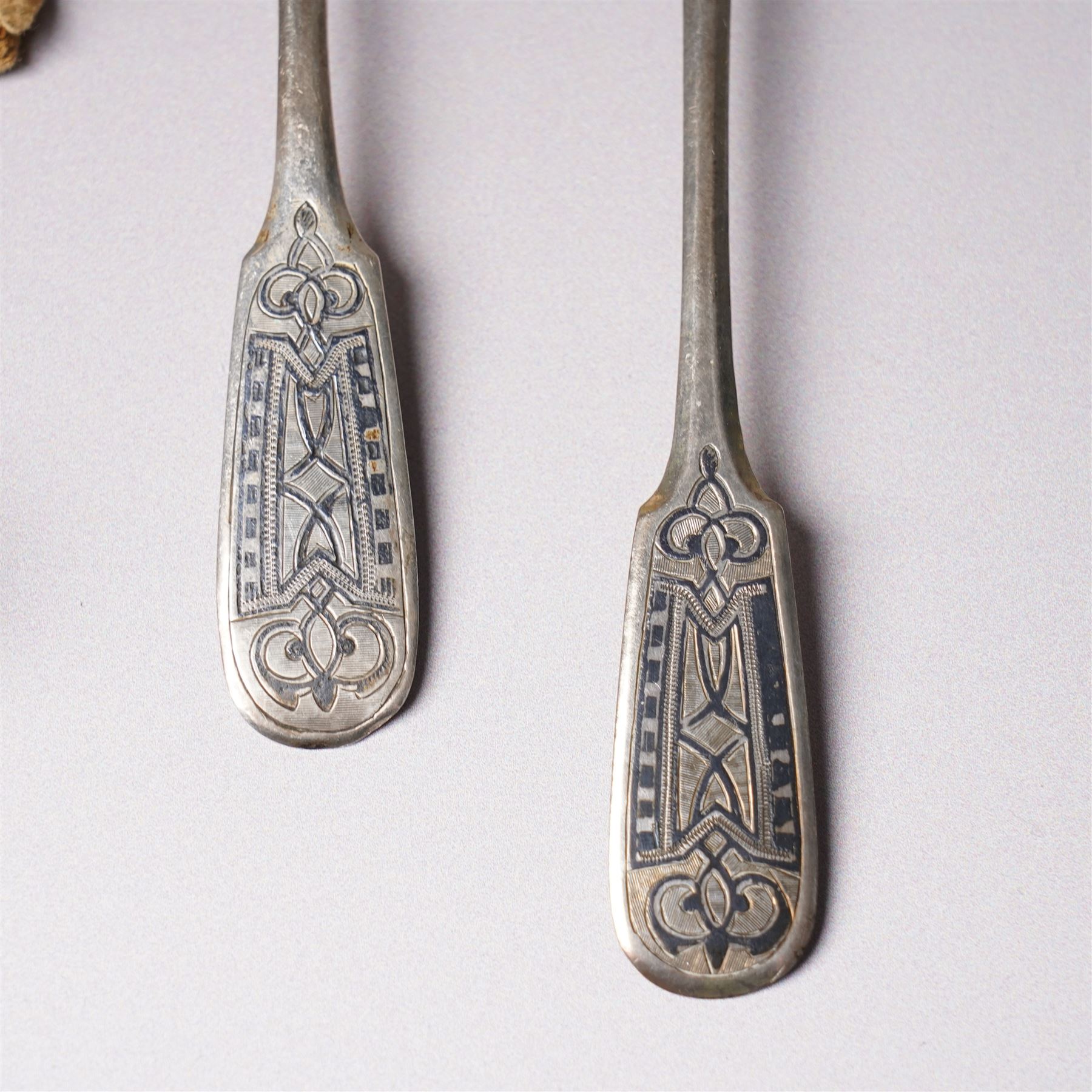 Five Russian 84 standard silver teaspoons with niello work stems and bowls marked 1876, five silver coffee spoons with swans head handles Birmingham 1910, Dutch Gero 90 standard preserve spoon and an early 19th century silver mustard spoon