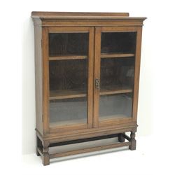 *Edwardian oak bookcase display cabinet enclosed by two glazed doors, W96cm, H128cm, D31cm