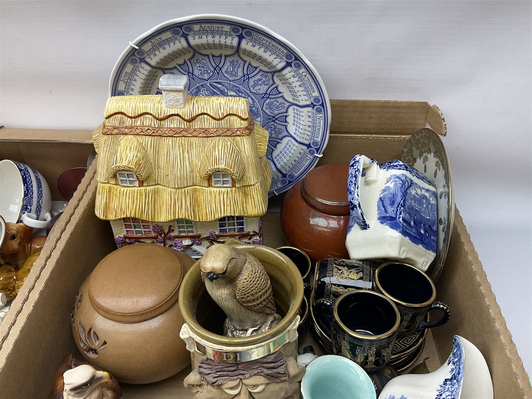 Quantity of various ceramics and glassware to include pair of Disney Mickey and Minnie Mouse cowboy Sherriff figures, stamped Japan beneath, Mason's ironstone, Wedgwood, Portmeirion, tea and dinner wares, collectors plates, glass animals etc in four boxes