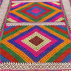 Afghan Suzni flatweave geometric design runner rug, decorated with trailing lozenges decorated with hooked motifs, within zig-zag bands, bright multi-coloured ground ivory and brown geometric main border