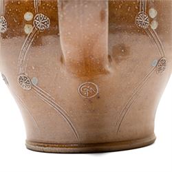 Gus Mableson - two studio pottery teapots, the larger example with a repeating floral pattern upon a brown ground, each with impressed makers marks below the handle, largest H18cm