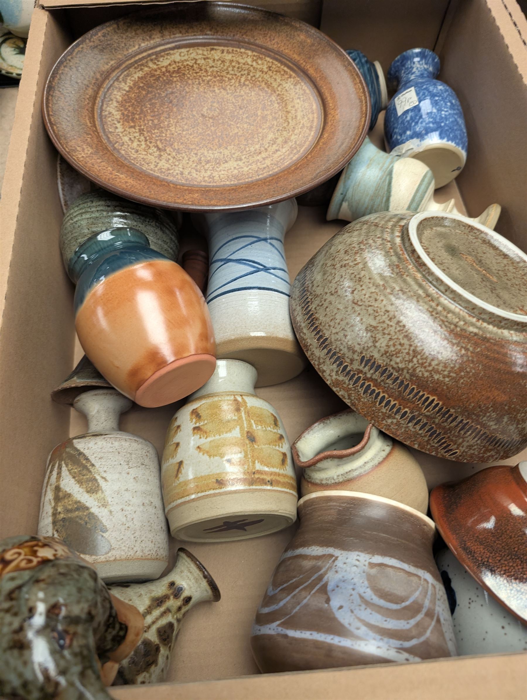 Collection of studio pottery, including bowls, vases, goblets and bottles, in four boxes 