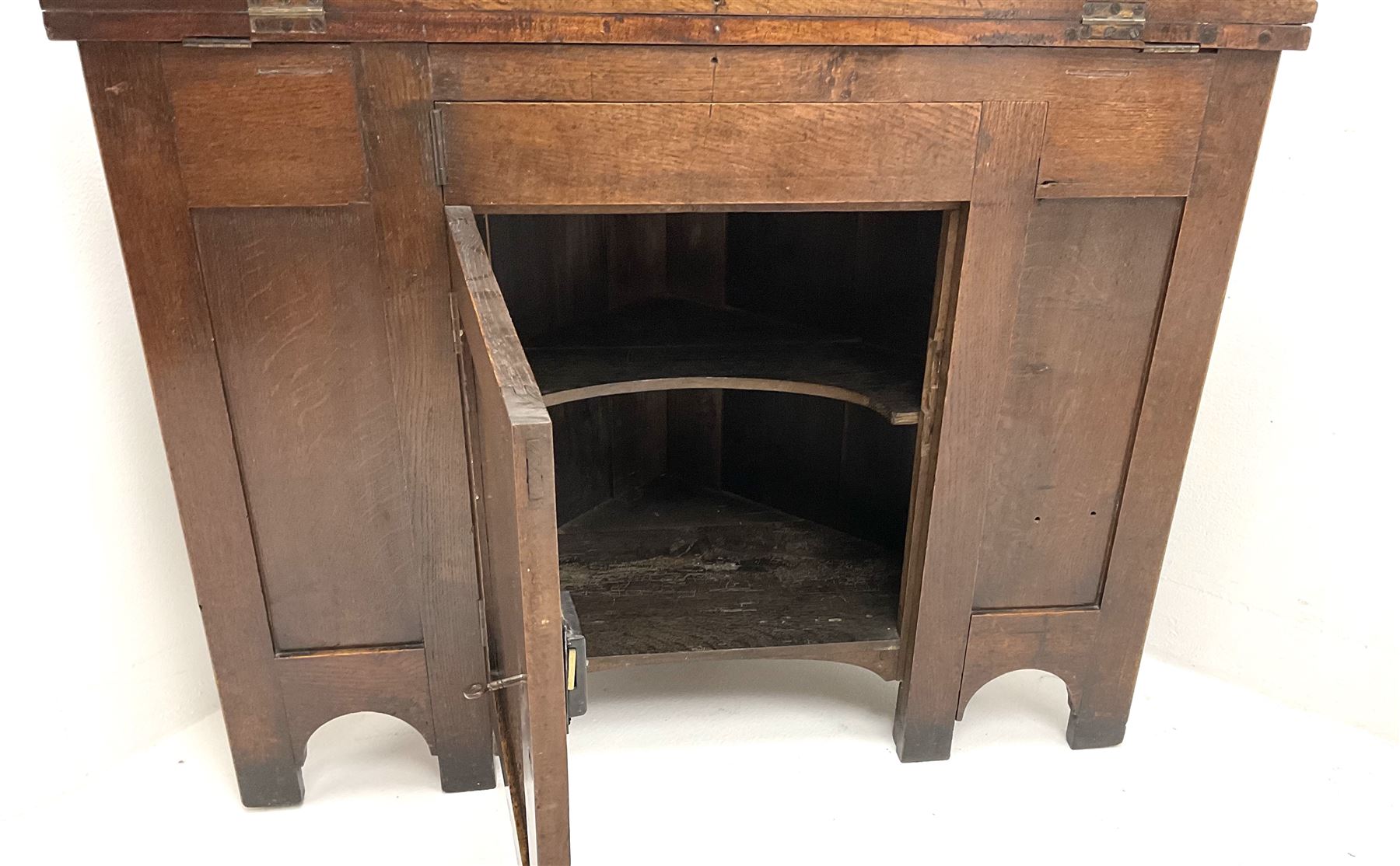 George III oak and mahogany corner campaign desk, single cupboard, folding top enclosing inset leather writing pad
