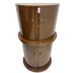 1930s Art Deco walnut demi-lune cocktail cabinet, enclosed by four curved doors, the upper section with mirrored interior, glass shelf and glass holders, the lower section fitted with shelves and bottle holders