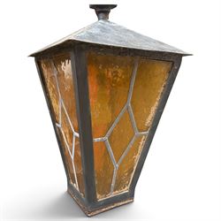 REVO Electric Co. Ltd., Tipton - early 20th century cast iron street lamp standard, the later hexagonal lantern with amber leaded glazing and pointed finial, supported on a swan-neck bracket above a ring-turned capital, tapering column and ladder rest, terminating in a moulded scrolling foliate-decorated base with lappet collar, stamped REVO

Provenance: formerly installed as street lighting in Prestwich, Greater Manchester