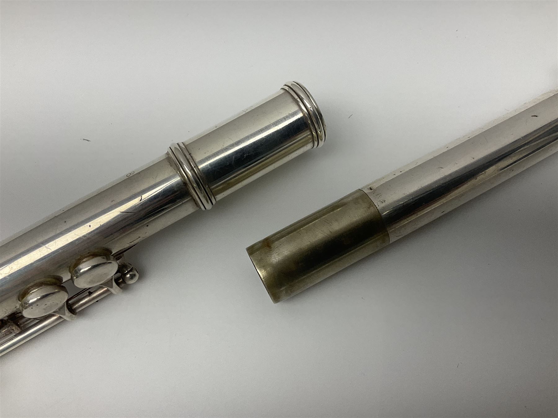 Boosey & Hawkes London Regent three-piece flute, serial no.345447; in B&H Bandhite hard carrying case; and Deg Music Company Inc. USA Claudel Model three-piece flute, serial no.491718, in hard carrying case (2)