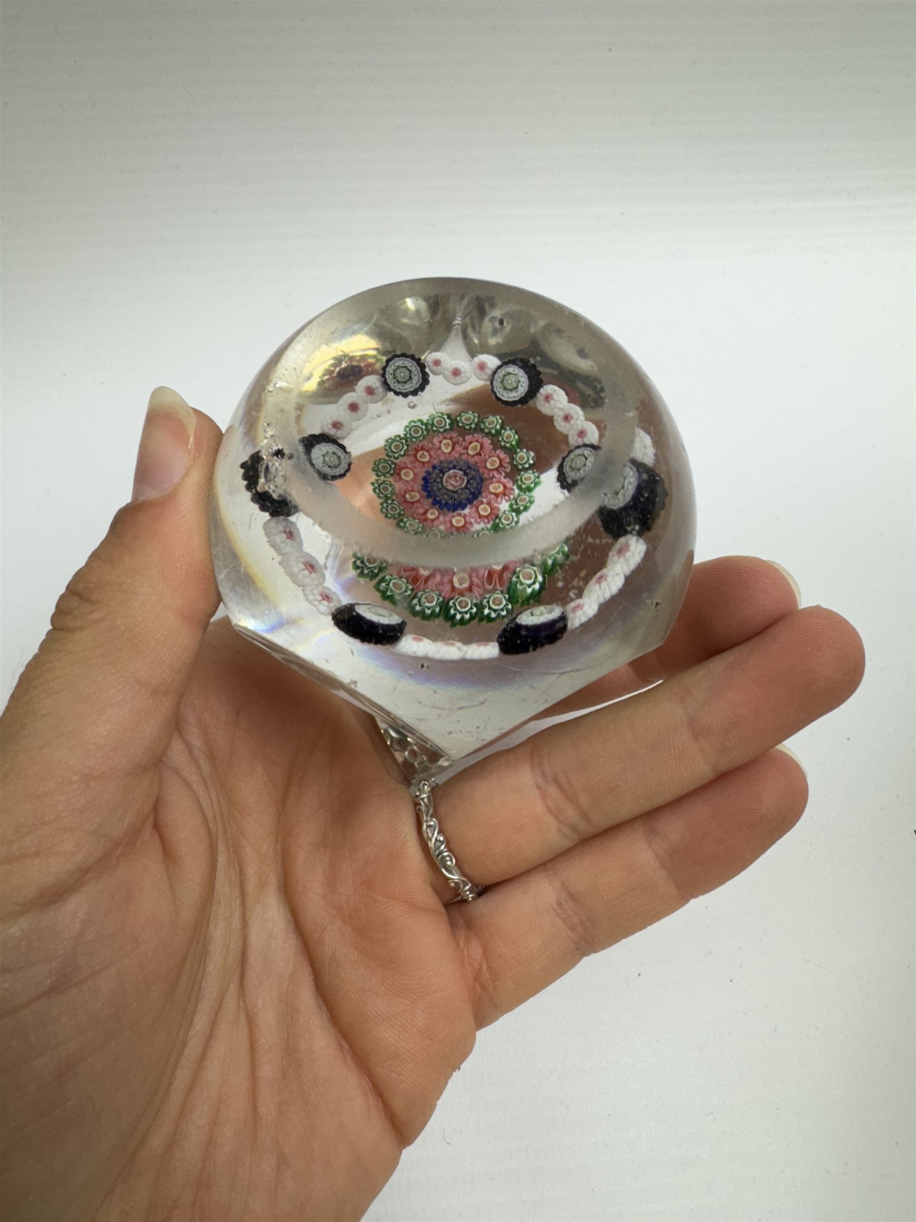 Glass Millefiori paperweight of hexagonal faceted form, H5cm