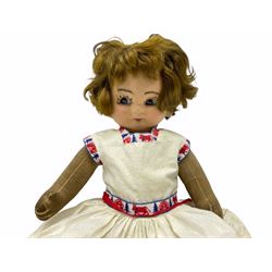 1920s Chad Valley 'Bambina' doll, the pressed felt head with applied hair, side glancing inset glass eyes, painted facial features and velvet jointed body, Hygenic and Bambina labels to the feet H46cm