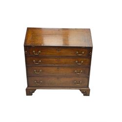 George III oak bureau, crossbanded fall-front concealing fitted interior, over four graduating drawers with cock-beaded facias, on pierced bracket feet