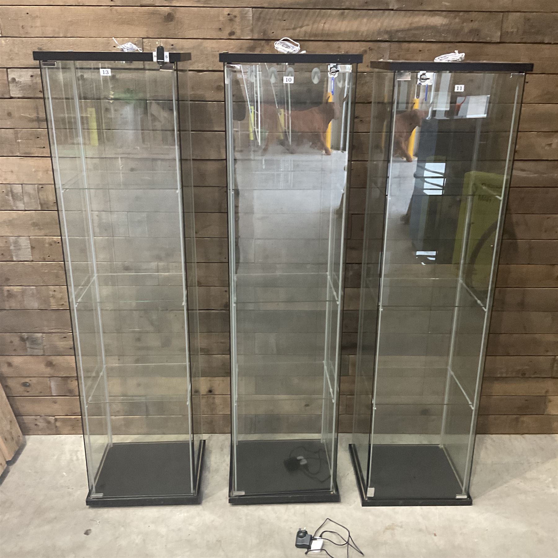 Three Ikea rosewood finish illuminated four glass shop display cabinets, with shelves and keys