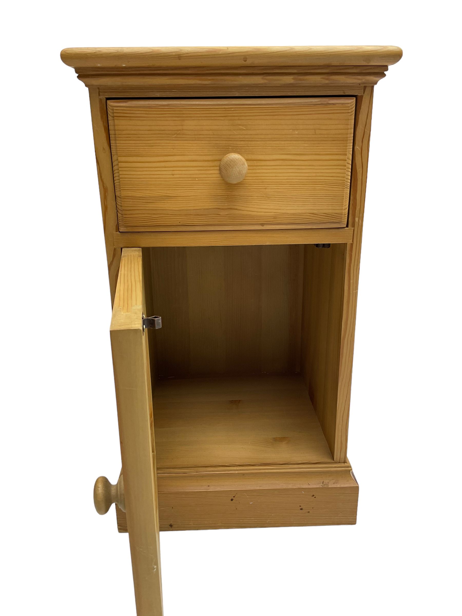 Pair traditional pine bedside cabinets, single drawer over cupboard