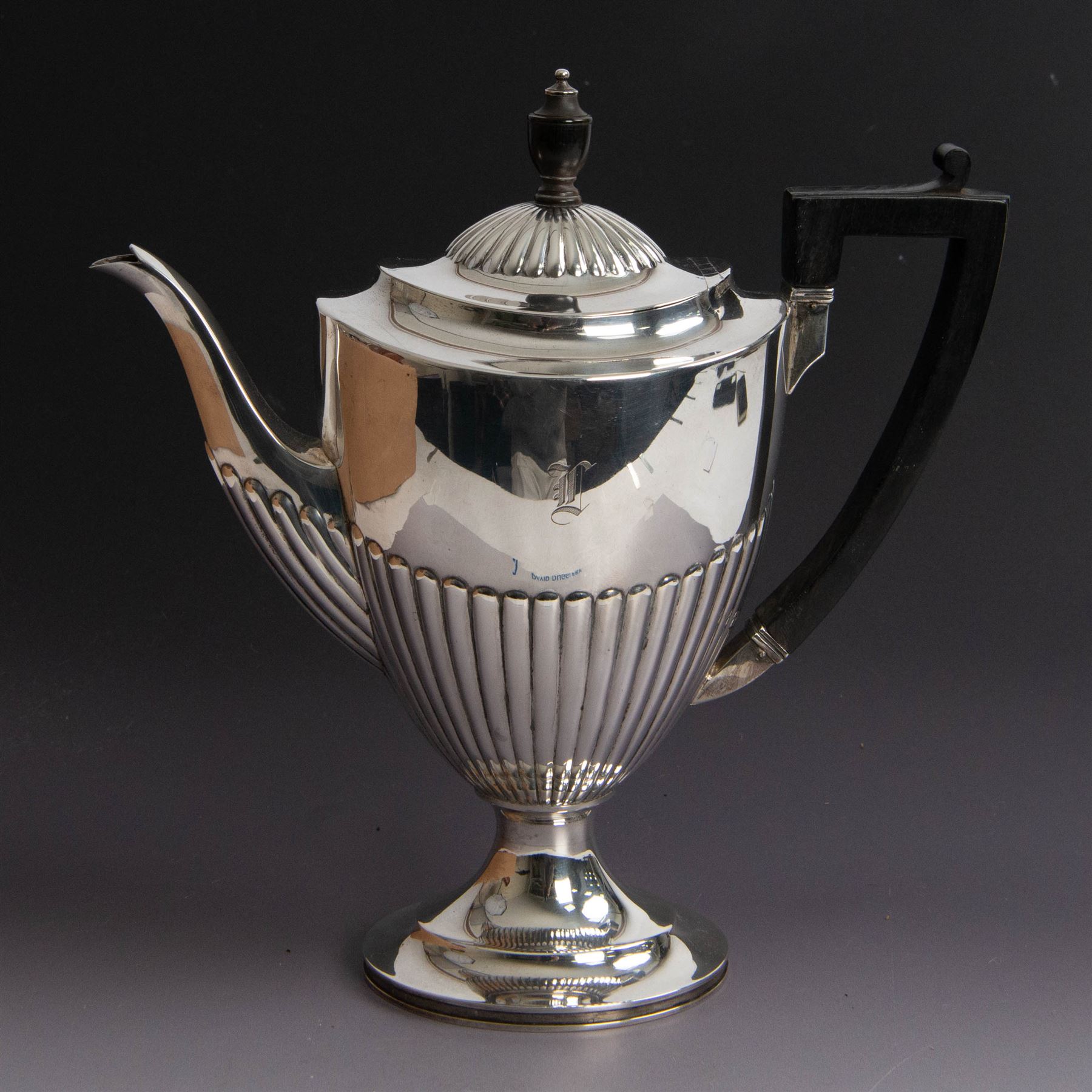 Victorian silver four piece tea service, comprising coffee pot, teapot, twin handled open sucrier and milk jug, all of oval part fluted form and engraved with initial to body, the coffee pot on oval stepped foot, coffee pot and teapot with ebonised wooden finials, hallmarked Elkington & Co, Birmingham 1888
